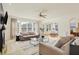 Inviting living room with neutral decor, an area rug, and lots of natural light at 6869 W Winding, McCordsville, IN 46055