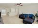 Living room area features neutral walls, a dark sofa and recessed lighting at 6869 W Winding, McCordsville, IN 46055