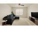 Cozy living room features a window and a dark sofa with blue pillows at 6869 W Winding, McCordsville, IN 46055