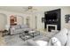 Bright living room featuring neutral decor, fireplace, and lots of natural light at 6869 W Winding, McCordsville, IN 46055