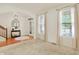 Bright living room with staircase and large windows provides an open and airy feel at 6869 W Winding, McCordsville, IN 46055