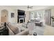 Living room with neutral decor, fireplace, and lots of natural light from the large window at 6869 W Winding, McCordsville, IN 46055
