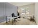 Bright home office featuring a gray accent wall, modern desk, and plenty of natural light at 6869 W Winding, McCordsville, IN 46055