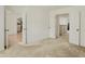 Spacious carpeted room with multiple doorways leading to other areas of the house at 6869 W Winding, McCordsville, IN 46055