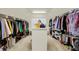 Spacious walk-in closet with custom shelving and ample storage for clothes and shoes at 6869 W Winding, McCordsville, IN 46055