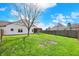 Green backyard with lots of space, a covered patio and partial tree cover at 701 Downing Dr, Greenwood, IN 46143