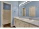 Bathroom featuring double vanity sinks with a framed mirror and a shower/tub combo at 701 Downing Dr, Greenwood, IN 46143