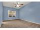 Bedroom featuring natural light, a ceiling fan, and neutral carpeting at 701 Downing Dr, Greenwood, IN 46143