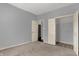 Bedroom featuring neutral walls and carpet with a closet at 701 Downing Dr, Greenwood, IN 46143