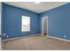 This bedroom features a window with natural light and a closet door at 701 Downing Dr, Greenwood, IN 46143