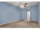 Bright bedroom with a ceiling fan and view of en-suite bathroom at 701 Downing Dr, Greenwood, IN 46143