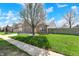 Beautiful brick home showcasing a lovely front yard with blossoming tree at 701 Downing Dr, Greenwood, IN 46143