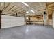Spacious two car garage with mounted work bench and garage door at 701 Downing Dr, Greenwood, IN 46143