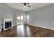 Bright living room with fireplace, sliding doors, and hardwood floors at 701 Downing Dr, Greenwood, IN 46143