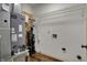 Utility area with a BAB furnace, water softener, and overhead wire rack at 701 Downing Dr, Greenwood, IN 46143