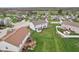 Aerial view highlighting the backyard, deck, and proximity to green spaces at 7048 Millet Ln, Avon, IN 46123