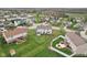 Expansive aerial view showcasing the home's backyard, patio, and surrounding neighborhood at 7048 Millet Ln, Avon, IN 46123