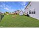 Spacious backyard with lush green grass, shed, and fire pit area at 7048 Millet Ln, Avon, IN 46123