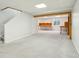 An open finished basement area featuring carpeted floors and wooden beams at 7048 Millet Ln, Avon, IN 46123