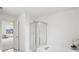Primary bathroom featuring a glass enclosed shower and soaking tub at 7048 Millet Ln, Avon, IN 46123