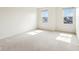 A bright bedroom with two windows at 7048 Millet Ln, Avon, IN 46123