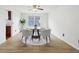 Dining room with natural light, decorative ceiling fan, and views of the yard at 7048 Millet Ln, Avon, IN 46123