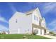 Rear exterior showcasing the home's siding, garage access, and spacious yard at 7048 Millet Ln, Avon, IN 46123