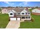 Beautiful two-story home with brick accents, a well-manicured lawn, and a two-car garage at 7048 Millet Ln, Avon, IN 46123