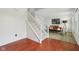 Bright foyer featuring a staircase leading to a living area with stylish furniture at 7048 Millet Ln, Avon, IN 46123