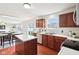 Updated kitchen with modern appliances and center island, perfect for cooking at 7048 Millet Ln, Avon, IN 46123