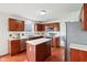 Spacious kitchen with stainless steel appliances, ample counter space, and center island at 7048 Millet Ln, Avon, IN 46123