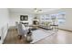 Inviting living room with a fireplace, neutral decor, and large windows at 7048 Millet Ln, Avon, IN 46123