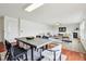 Open-concept living and dining space with modern decor and wood floors at 7048 Millet Ln, Avon, IN 46123