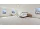 Spacious main bedroom with vaulted ceiling, plush carpeting, and natural light at 7048 Millet Ln, Avon, IN 46123