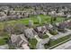 Stunning aerial view of the neighborhood showcasing well-manicured lawns, mature trees, and charming homes at 7242 River Glen Dr, Fishers, IN 46038
