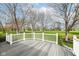 Back deck overlooking the lush green backyard and adjacent golf course at 7242 River Glen Dr, Fishers, IN 46038