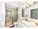 Bathroom featuring granite counters, vanity with storage, and glass shower at 7242 River Glen Dr, Fishers, IN 46038