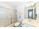 Bathroom featuring a glass enclosed bathtub and shower, mirror, and vanity at 7242 River Glen Dr, Fishers, IN 46038