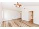Bright bedroom featuring vaulted ceilings, modern ceiling fan and wood-look flooring at 7242 River Glen Dr, Fishers, IN 46038