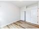 Bright bedroom featuring hardwood floors and white trim around the base of the walls at 7242 River Glen Dr, Fishers, IN 46038