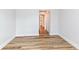 Bedroom with wood-look flooring and view of en suite bathroom at 7242 River Glen Dr, Fishers, IN 46038