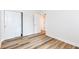 Bright bedroom featuring hardwood floors and white trim around the base of the walls at 7242 River Glen Dr, Fishers, IN 46038