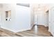 Bright, open foyer with hardwood floors and view into other rooms at 7242 River Glen Dr, Fishers, IN 46038
