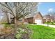 Charming brick home with well-manicured lawn and mature flowering tree at 7242 River Glen Dr, Fishers, IN 46038