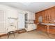 An organized garage with cabinets, a utility sink, and work space at 7242 River Glen Dr, Fishers, IN 46038