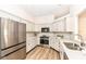 Well-lit kitchen features stainless steel appliances, granite countertops, and ample storage at 7242 River Glen Dr, Fishers, IN 46038