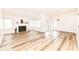 Spacious living room with fireplace, vaulted ceiling, and abundant natural light at 7242 River Glen Dr, Fishers, IN 46038