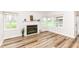Living room with fireplace and large windows offering plenty of natural light at 7242 River Glen Dr, Fishers, IN 46038
