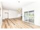 Spacious living room with hardwood floors, fireplace, and sliding glass door to back patio at 7242 River Glen Dr, Fishers, IN 46038