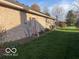 Home exterior showing a brick facade and a green lawn at 7664 Lincoln Trl, Plainfield, IN 46168